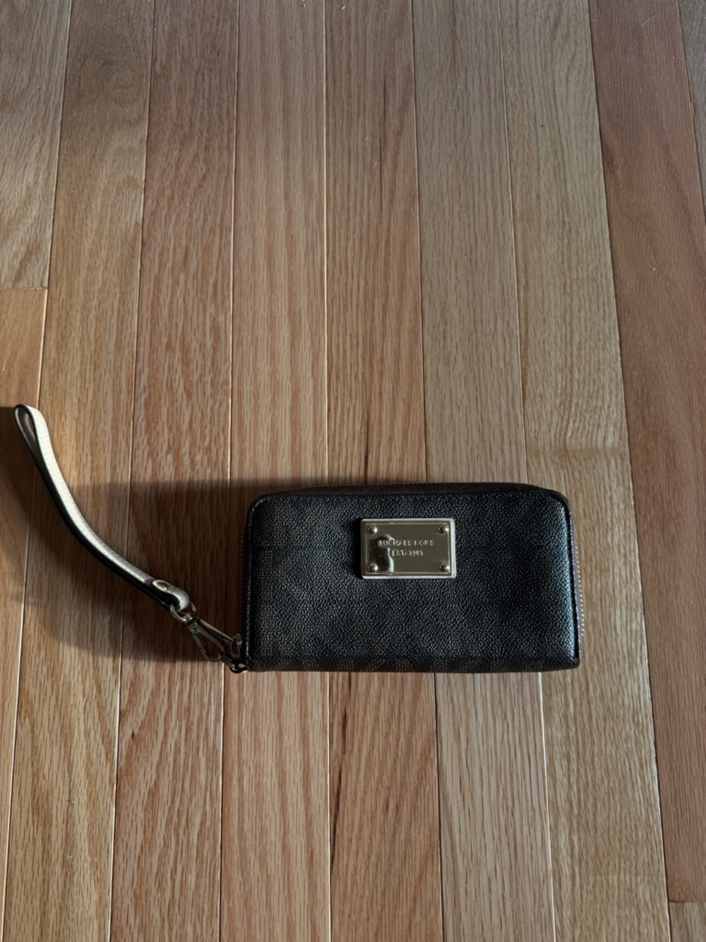 Michael Kors Black Wristlet with Gold Logo Plate
